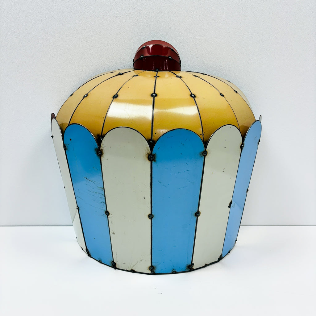 wall mounted 44-gallon drum sculpture of cupcake made by metal metcalfe