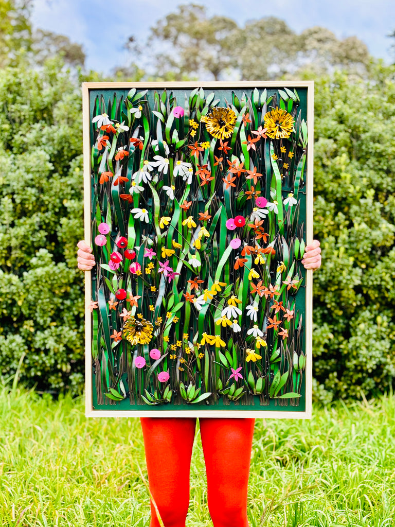 Framed Metal Meadows with orange tights   plasma cut background and lazer cut wild meadow flowers