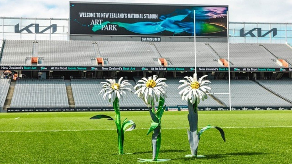 3 Everlasting metal sculpture daisies on Eden Park pitch made from repurposed 44-gallon drums by sister-duo Katie Baptiste, Amy Lynch: Metal Metcalfe