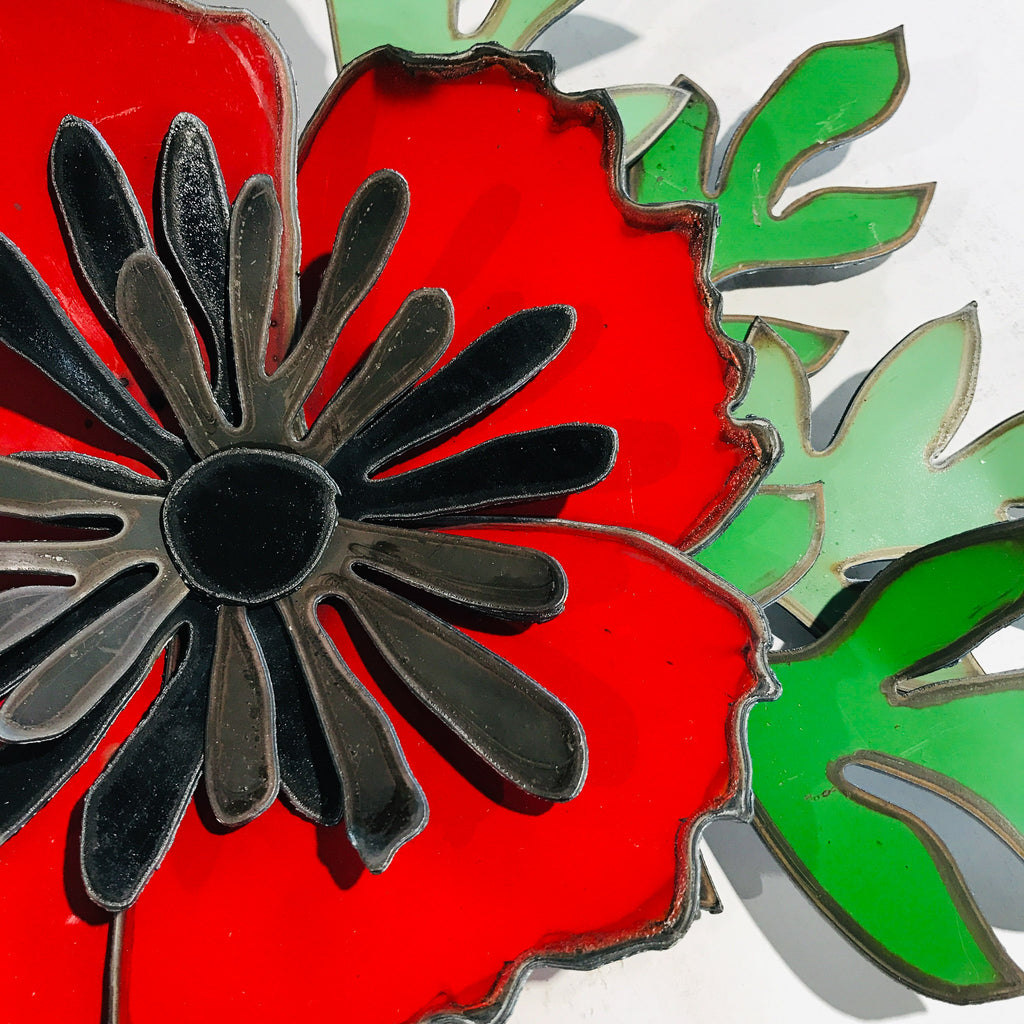 Poppy Corsage. Wall sculpture. Made from 44 gallon drums. repurposed material made by Metal Metcalfe METcALfe.