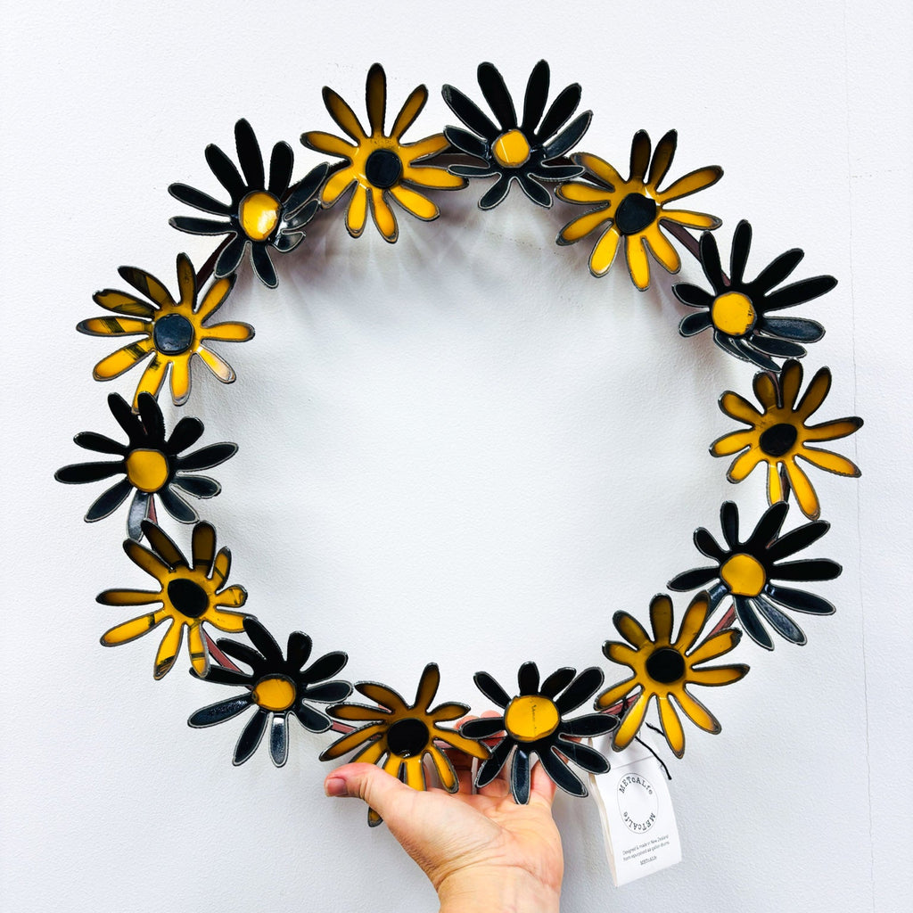 Yellow Black daisy wreath made from repurpossed 44-gallon drums